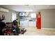 Garage featuring epoxy floors and a practical laundry area with washer and dryer, adding functionality and convenience at 4523 Clearwater Harbor S Dr, Largo, FL 33770
