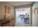 Inviting hallway with a bar area, flowing into a sunroom with ample seating and a view of the outdoors at 4523 Clearwater Harbor S Dr, Largo, FL 33770