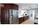 Modern kitchen with stainless steel appliances and dark wood cabinets at 4523 Clearwater Harbor S Dr, Largo, FL 33770
