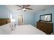 Serene main bedroom with light blue walls, a spacious layout, and access to a modern ensuite bathroom at 4523 Clearwater Harbor S Dr, Largo, FL 33770