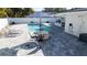 Pool with outdoor seating and well-maintained patio at 4523 Clearwater Harbor S Dr, Largo, FL 33770