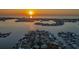 Panoramic sunset view of the waterfront community, showcasing the stunning water views and vibrant sky at 4523 Clearwater Harbor S Dr, Largo, FL 33770