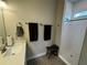 Bathroom with walk-in shower, tile flooring, and modern vanity at 493 Omen St, Punta Gorda, FL 33982