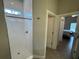 Bright bathroom with shower, and access to other rooms at 493 Omen St, Punta Gorda, FL 33982
