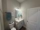 Simple bathroom with a vanity, toilet, and modern design at 493 Omen St, Punta Gorda, FL 33982