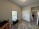 Bedroom with double doors, window, and a playful turtle rug at 493 Omen St, Punta Gorda, FL 33982