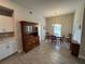 Bright dining room with wooden hutch and chandelier at 493 Omen St, Punta Gorda, FL 33982