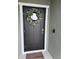 Modern front door with stylish wreath and keyless entry at 493 Omen St, Punta Gorda, FL 33982