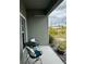 Cozy front porch with a small table and two chairs at 493 Omen St, Punta Gorda, FL 33982