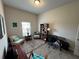 Bright home office with built-in shelving and comfortable seating at 493 Omen St, Punta Gorda, FL 33982