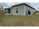 Side view showing house exterior and landscaping at 493 Omen St, Punta Gorda, FL 33982