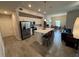 Open concept kitchen with island and stainless steel appliances at 493 Omen St, Punta Gorda, FL 33982
