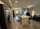 Open kitchen with island, stainless steel appliances, and breakfast bar at 493 Omen St, Punta Gorda, FL 33982