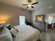 Main bedroom with king bed and access to the bathroom at 493 Omen St, Punta Gorda, FL 33982