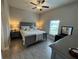 Main bedroom with king-size bed and dresser at 493 Omen St, Punta Gorda, FL 33982