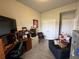 Home office with built-in shelving and comfortable seating at 493 Omen St, Punta Gorda, FL 33982