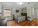 Bright bedroom with hardwood floors and built-in shelving at 5225 Algerine Pl, Wesley Chapel, FL 33544