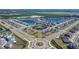 Aerial view of Berry Bay community with lake and houses at 5322 Fiddle Fig Ave, Wimauma, FL 33598