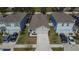 One-story house in a neighborhood with other houses and cars at 5322 Fiddle Fig Ave, Wimauma, FL 33598