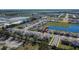 Aerial view of a new home community with lake access at 5322 Fiddle Fig Ave, Wimauma, FL 33598