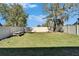 Spacious backyard with grassy area and picnic table at 5322 Fiddle Fig Ave, Wimauma, FL 33598