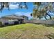 Large backyard with grill and screened porch at 5322 Fiddle Fig Ave, Wimauma, FL 33598