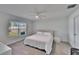 Spacious bedroom with a king-size bed and plenty of natural light at 5322 Fiddle Fig Ave, Wimauma, FL 33598