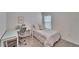 Bedroom with built-in workspace and a bed at 5322 Fiddle Fig Ave, Wimauma, FL 33598