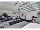 Garage interior with gym equipment at 5322 Fiddle Fig Ave, Wimauma, FL 33598