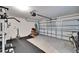 Garage with home gym setup and storage at 5322 Fiddle Fig Ave, Wimauma, FL 33598