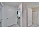 Bright hallway with doors to bedrooms and a bathroom at 5322 Fiddle Fig Ave, Wimauma, FL 33598