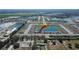 Aerial view of house location in a neighborhood near a lake at 5322 Fiddle Fig Ave, Wimauma, FL 33598