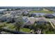 Aerial view of houses with fenced backyards and landscaping at 5322 Fiddle Fig Ave, Wimauma, FL 33598