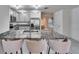 Kitchen island with granite countertops and breakfast bar seating at 5322 Fiddle Fig Ave, Wimauma, FL 33598