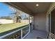 Screened porch overlooking a grassy backyard at 5322 Fiddle Fig Ave, Wimauma, FL 33598