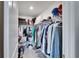 Large walk-in closet with ample shelving and hanging space at 5322 Fiddle Fig Ave, Wimauma, FL 33598