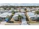 Overhead view of a well-situated property in a peaceful community, showcasing its metal roof and convenient carport at 5539 Regal Way, Zephyrhills, FL 33541