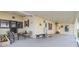 Inviting front porch with neutral furniture, and a small sitting area, perfect for enjoying the outdoors at 5539 Regal Way, Zephyrhills, FL 33541