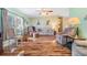 Inviting living room featuring hardwood flooring, and comfortable furniture at 5539 Regal Way, Zephyrhills, FL 33541