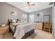 Cozy main bedroom featuring neutral wall colors, carpet flooring and a ceiling fan at 5539 Regal Way, Zephyrhills, FL 33541