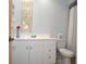 Bathroom with single vanity and toilet at 5565 Salem Square N Dr, Palm Harbor, FL 34685