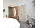 Bedroom with a comfortable bed and built-in closet at 5565 Salem Square N Dr, Palm Harbor, FL 34685