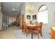 Bright dining room with a chandelier and view into the living room at 5565 Salem Square N Dr, Palm Harbor, FL 34685