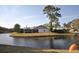 Back of house with screened porch overlooking peaceful canal at 5565 Salem Square N Dr, Palm Harbor, FL 34685