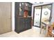 Eat-in kitchen with access to a private patio and built-in hutch at 5565 Salem Square N Dr, Palm Harbor, FL 34685