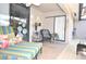 Cozy screened porch, furnished with cushioned seating at 5565 Salem Square N Dr, Palm Harbor, FL 34685