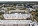 Expansive aerial view of a large condominium complex, showcasing its well-maintained grounds and building exteriors at 5623 80Th N St # 505, St Petersburg, FL 33709