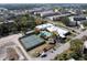 Aerial view showcasing the pool, tennis courts, and amenities within the condominium complex at 5623 80Th N St # 505, St Petersburg, FL 33709