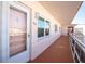 Building hallway with light-colored walls and flooring, featuring a unit entrance at 5623 80Th N St # 505, St Petersburg, FL 33709