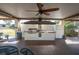 Community outdoor kitchen with grill and seating at 5623 80Th N St # 505, St Petersburg, FL 33709